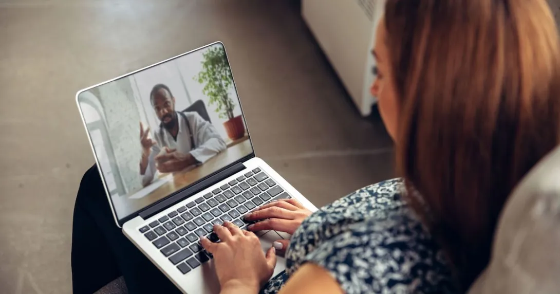   Person on a telehealth call on their laptop