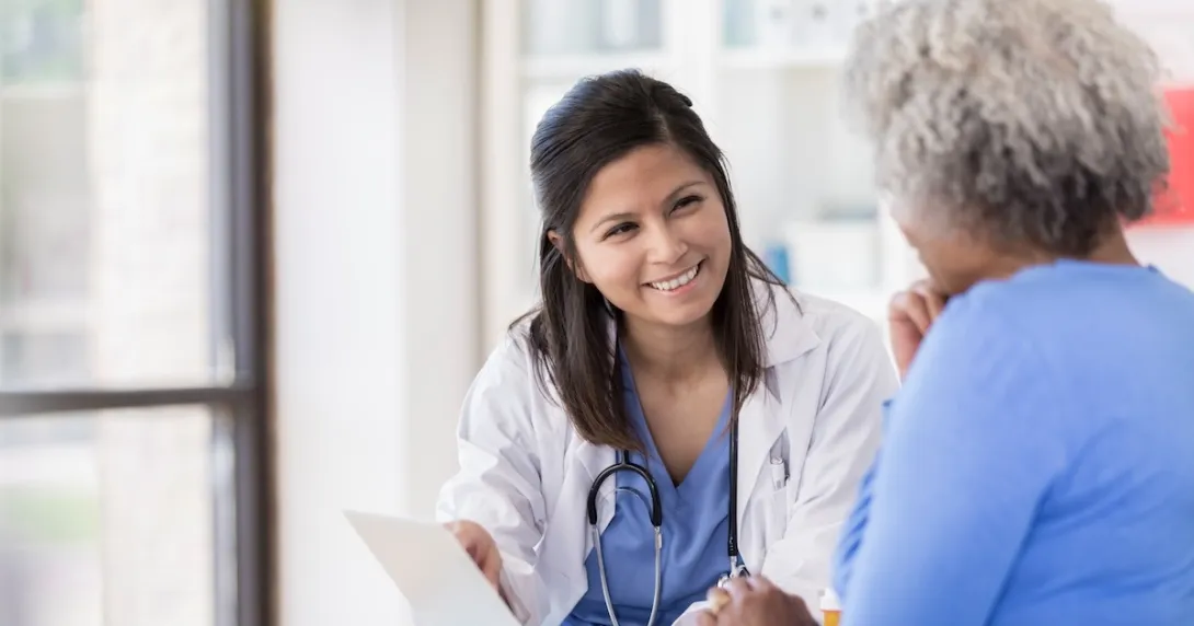 Healthcare professional consulting with a patient Healthcare professional consulting with a patient