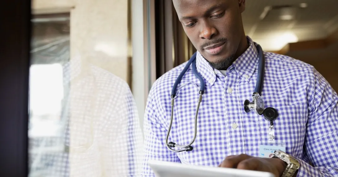 Healthcare provider looking at a computer
